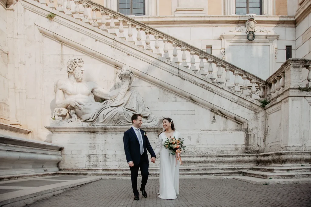 a couple is walking in Campidoglio Square