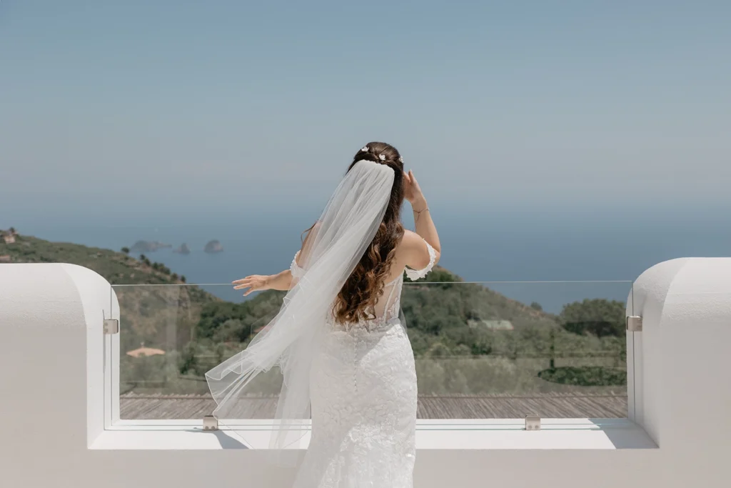 a bride is looking over the sea in Amalfi Coast from a terrace