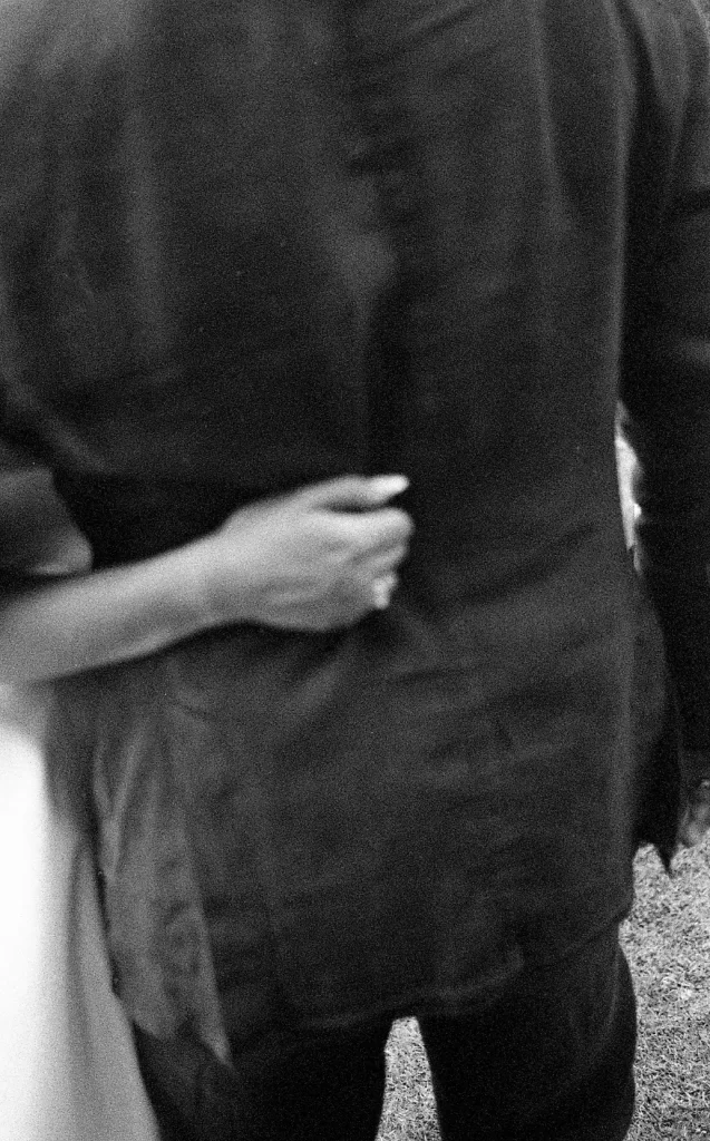 detail of an hand grabbing a jacket