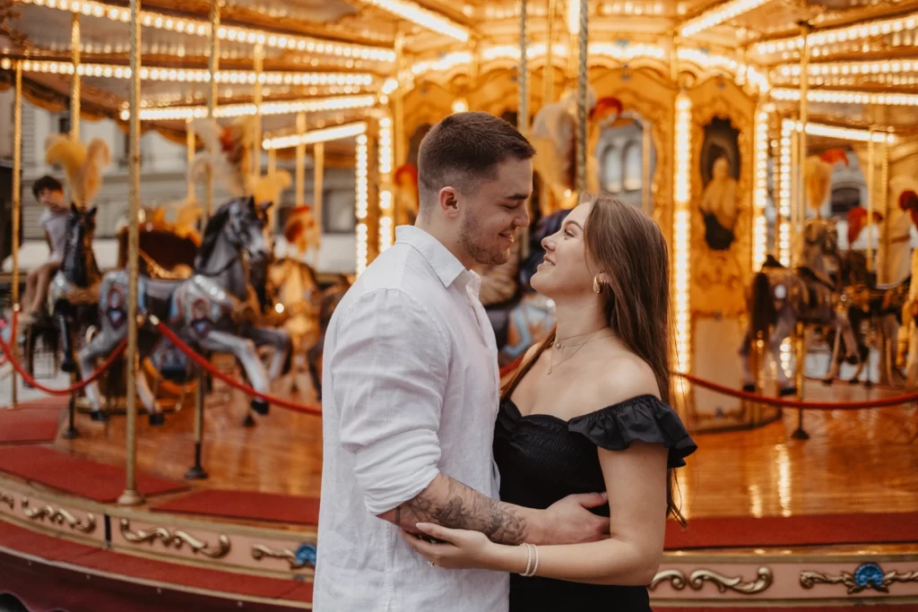 a couple in Florence in front of a carousel