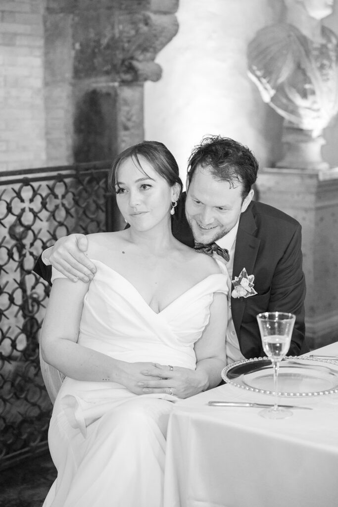 a man is smiling and a bride is looking away