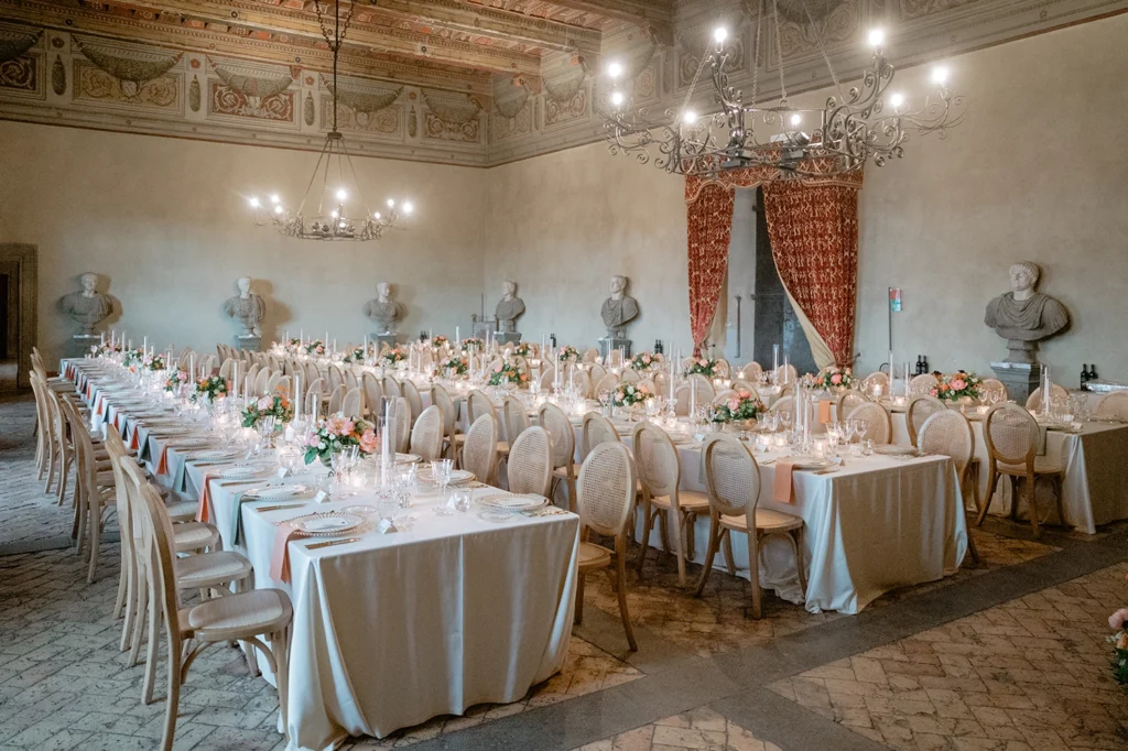 Set up tables and decorations inside Castello Orsini Odescalchi di Bracciano