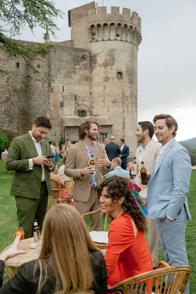 some guests enjoying the aperitivo in the gardens of Castello Orsini Odescalchi di Bracciano
