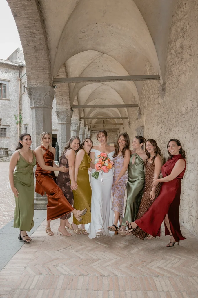 a group of bridesmaids under the arches at the Castello Orsini Odescalchi di Bracciano