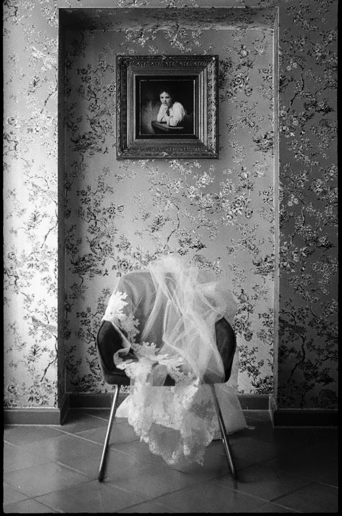 empty chair with a bridal veil on top
