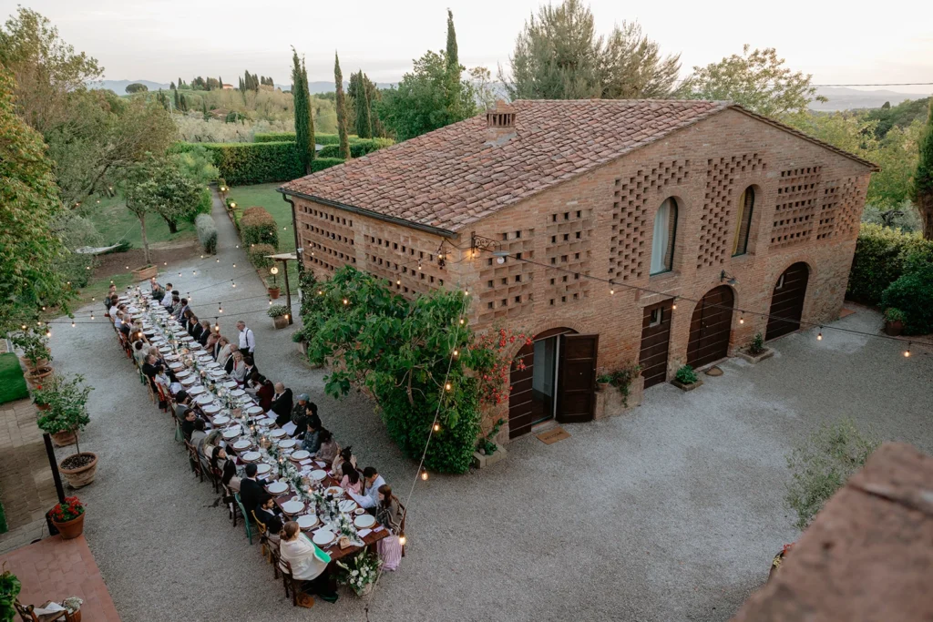 Long Farmhouse Table with Colorful Chairs at Podere San Giorgio, Palaia Tuscany